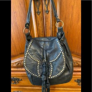 Genuine black leather handbag made in Argentina .